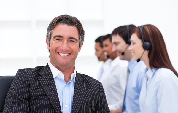 Confident manager presenting a call center — Stock Photo, Image