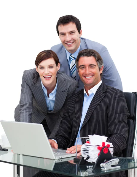 Merry business team working at a computer — Stock Photo, Image
