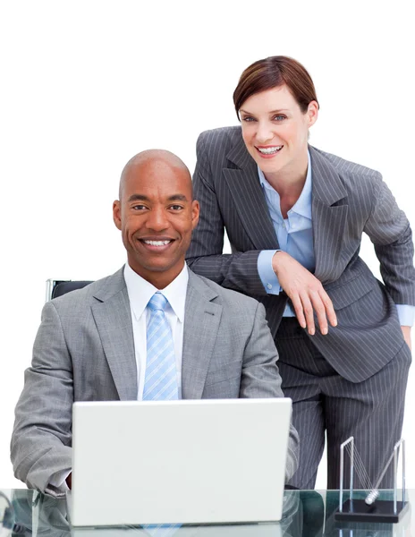 Charming manager assisting her colleague at a computer — Stock Photo, Image