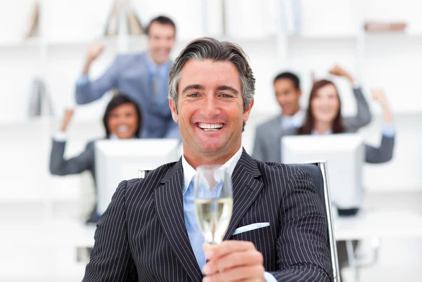 stock image Prosperous manager and his team drinking champagne