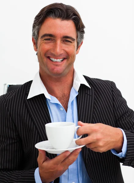 Attractive businessman drinking coffee — Stock Photo, Image