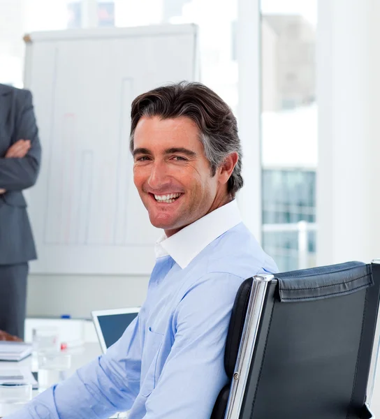 Attractive businessman smiling at the camera — Stock Photo, Image