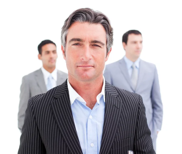 Charming businessman posing in front of his team — Stock Photo, Image