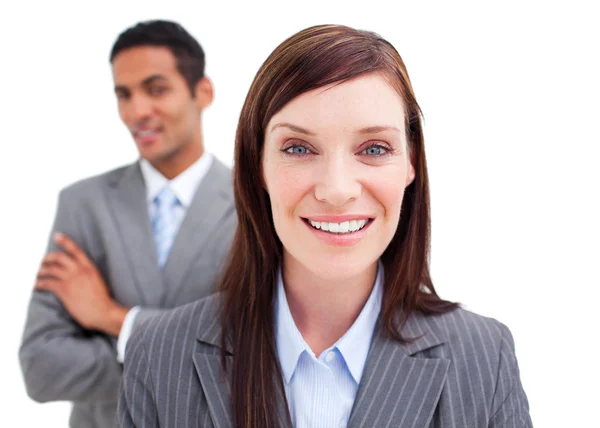 Portrait of businesswoman posing in front of her colleague — Stock Photo, Image