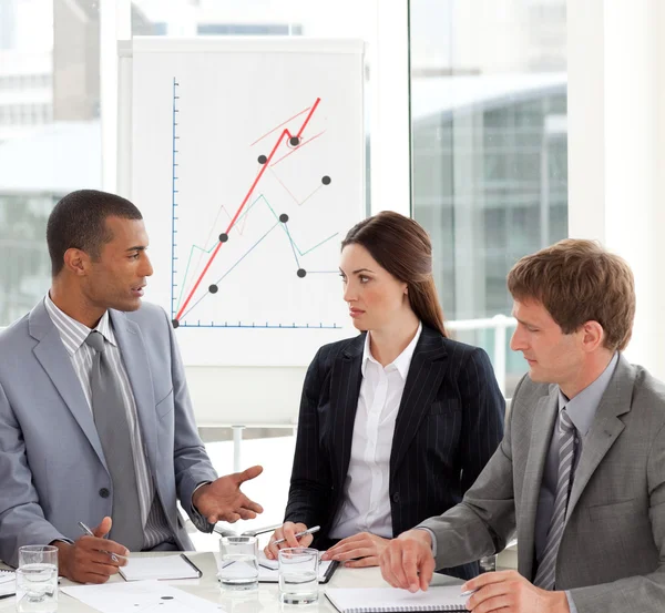 Serious co-workers studying a new business plan — Stock Photo, Image