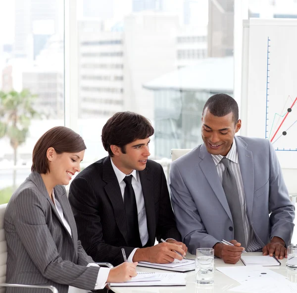 A Business group showing diversity discussing a new strategy — Stock Photo, Image