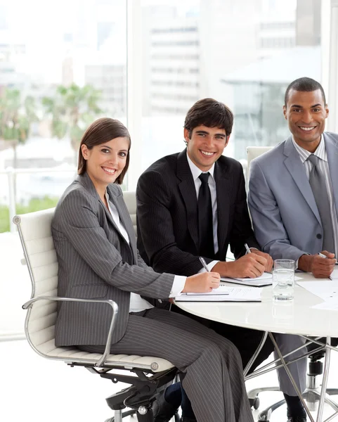 Three co-workers smiling at the camera — Stock Photo, Image