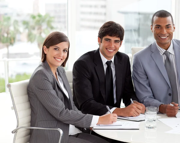 Multi-ethnic co-workers smiling at the camera — Stock Photo, Image