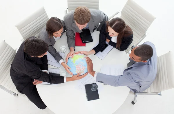 High angle of a business holding a terrestrial globe — Stock Photo, Image