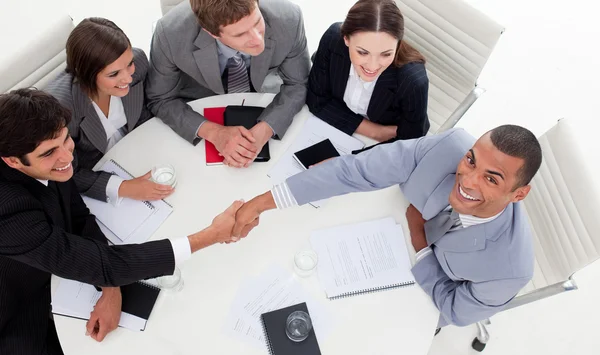 Business smiling at the camera while closing a deal — Stock Photo, Image