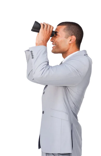Young afro-american businessman using binoculars — Stock Photo, Image