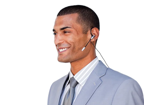 Sonriente hombre de negocios seguro con auriculares puestos — Foto de Stock