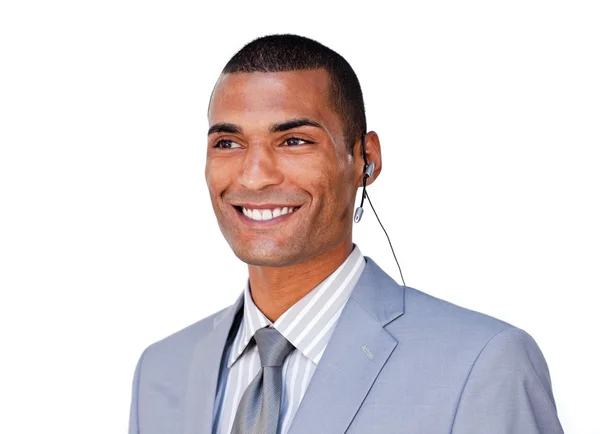Homem de negócios confiante com fone de ouvido contra — Fotografia de Stock