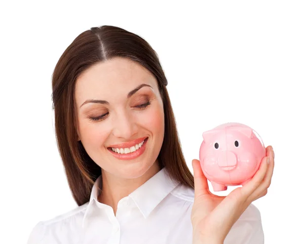 Confident businesswoman holding a piggybank — Stock Photo, Image