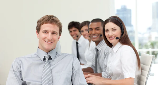Young manager in front of his team in a call center — Stock Photo, Image