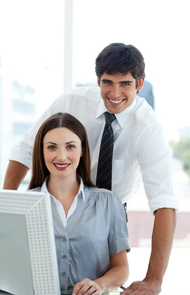 Co-workers smiling at the camera — Stock Photo, Image