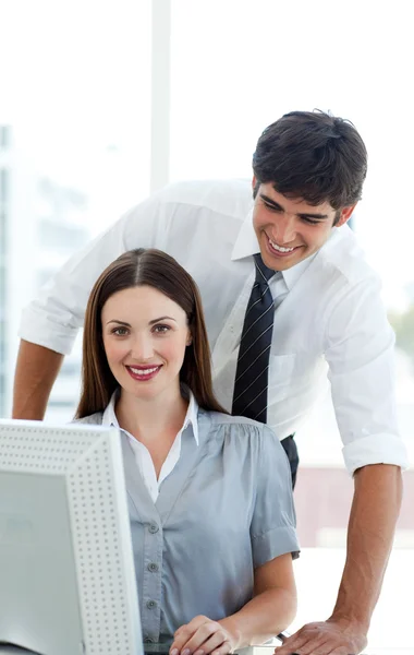 Attractive Co-workers at a computer — Stock Photo, Image