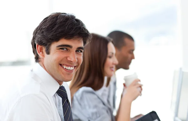 Handsome businessman and his team — Stock Photo, Image