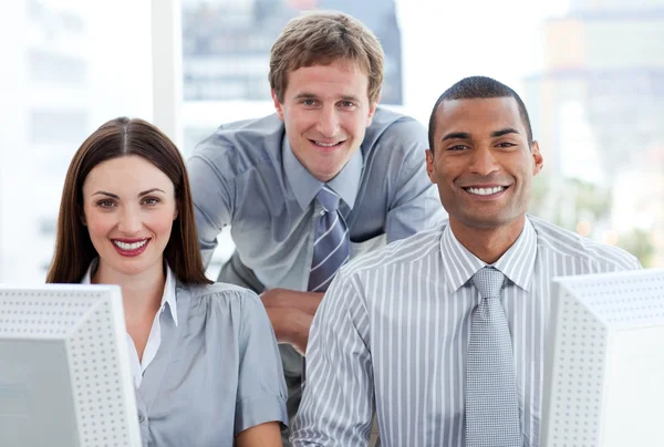 Ambitious business group working at a computer — Stock Photo, Image