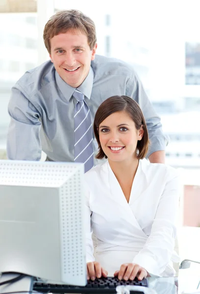 Confident manager helping his colleague — Stock Photo, Image