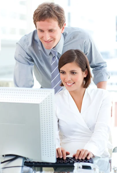 Young manager helping his colleague — Stock Photo, Image