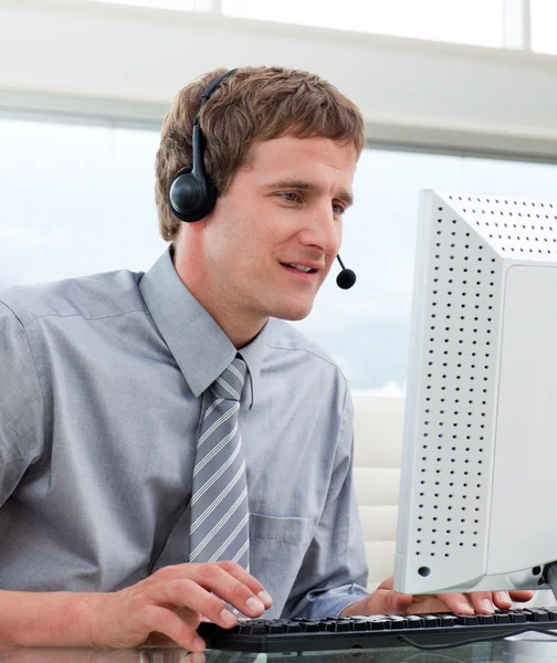 Portrait of businessman with headset on — Stock Photo, Image