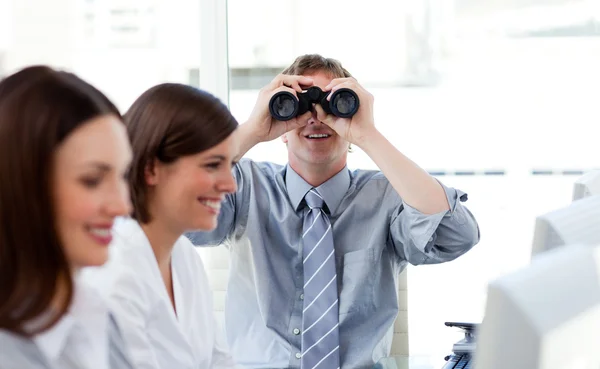 Charismatic manager looking through binoculars — Stock Photo, Image