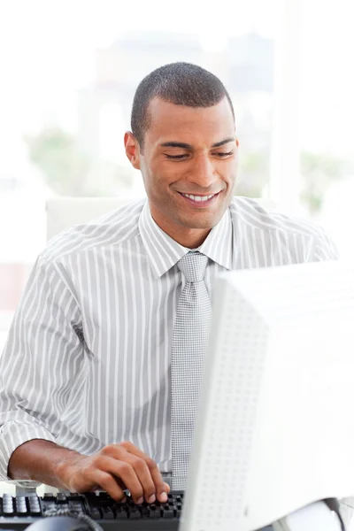 Confident businessman working at a computer — Stock Photo, Image