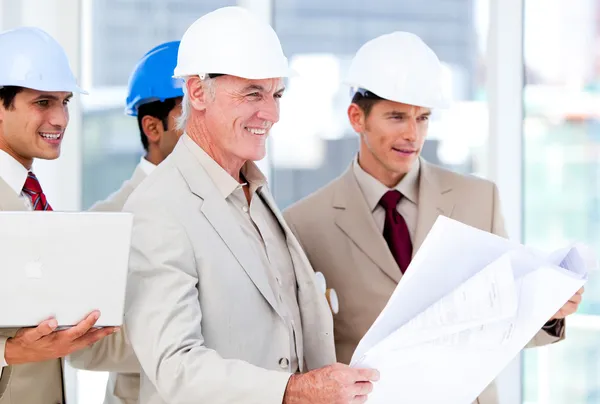 Architect team working on a building project Stock Photo