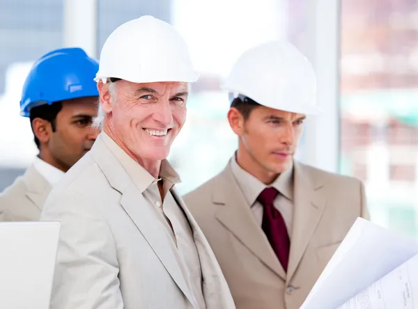 Smiling architect team working on a building project — Stock Photo, Image