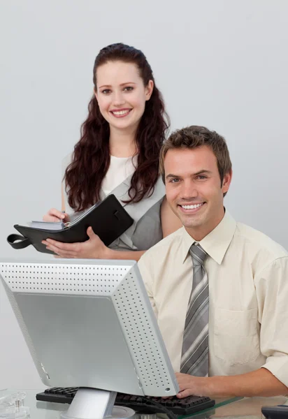 Charming manager checking her employee's work Stock Photo