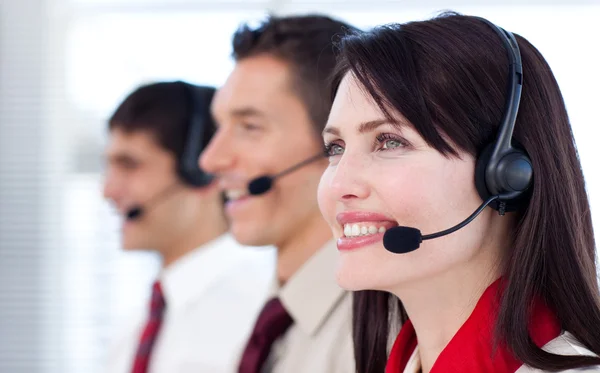 Happy co-workers with headsets on — Stock Photo, Image