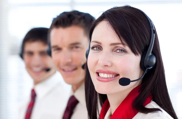 Business team with headset on smiling at the camera — Stock Photo, Image