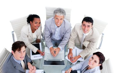 High angle of a multi-ethnic business team in a meeting clipart