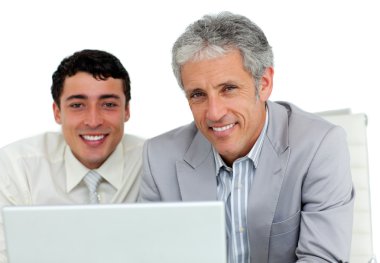 Serious businessmen working at a computer clipart