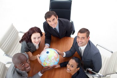 High view of happy business holding a globe. Global busin clipart