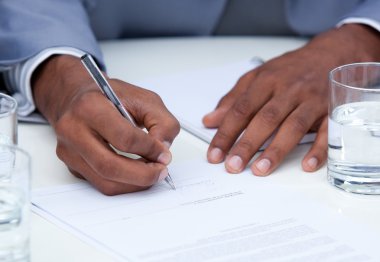 Close-up of ambitious business man signing a contract clipart