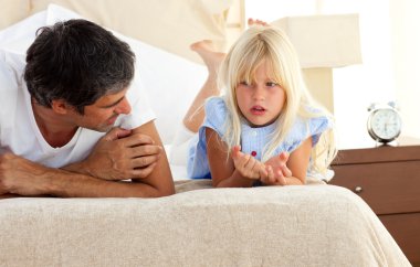 Little girl talking seriously with her father clipart