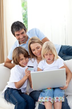 Young family shopping online clipart