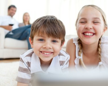 Cute siblings lying on the floor clipart