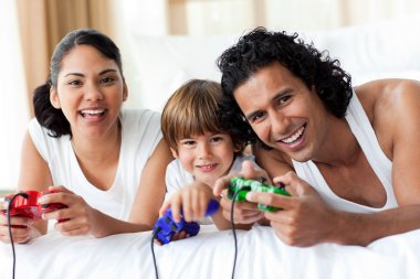 Boy and his parents playing video games clipart