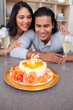 Charming man and his wife celebrating his birthday clipart