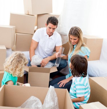 Positive family packing boxes clipart