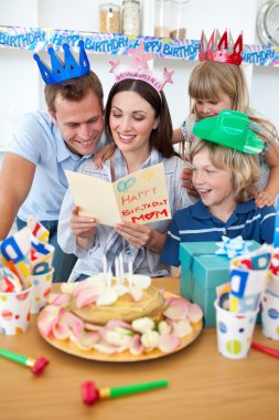 Joyful family celebrating mother's birthday clipart