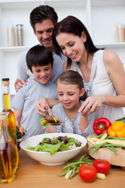 Happy family cooking together clipart