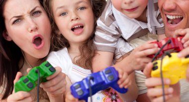 Excited family playing video games clipart