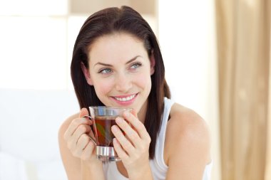 Attractive woman drinking tea clipart