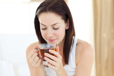 Pretty woman drinking tea clipart