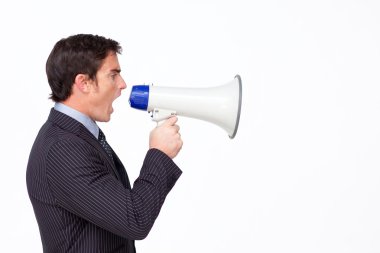 Profile of a businessman shouting through a megaphone clipart