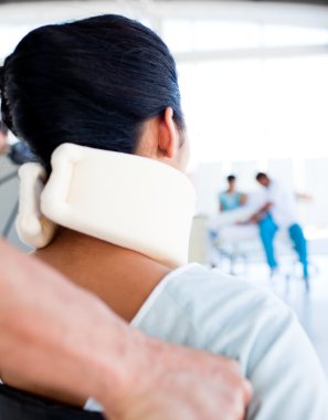 Close-up of a woman with a neckbrace sitting on wheelchair clipart